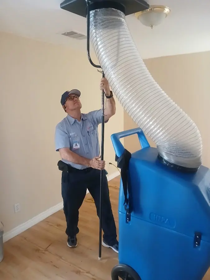 Furnace Tune-Up technician using HEPA equipment in Pineville